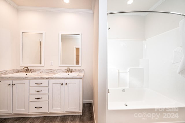 bathroom featuring wood-type flooring, vanity, shower / tub combination, and crown molding