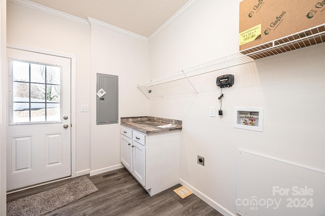 laundry area featuring electric dryer hookup, dark wood-type flooring, electric panel, hookup for a washing machine, and ornamental molding