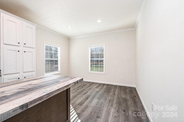 interior space with hardwood / wood-style flooring and crown molding