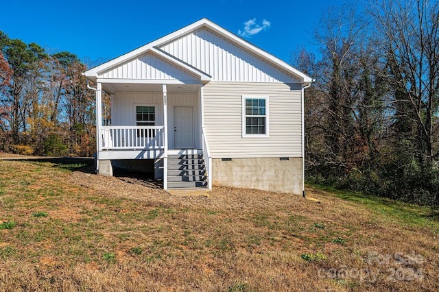 exterior space featuring a porch and a front lawn