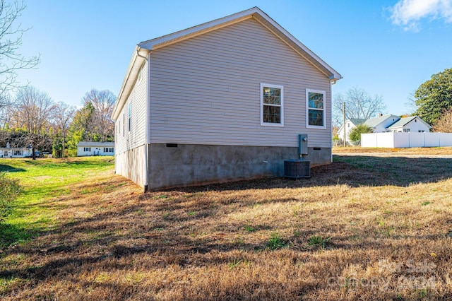 view of property exterior with a yard