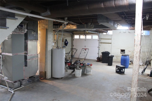 garage with electric water heater and heating unit