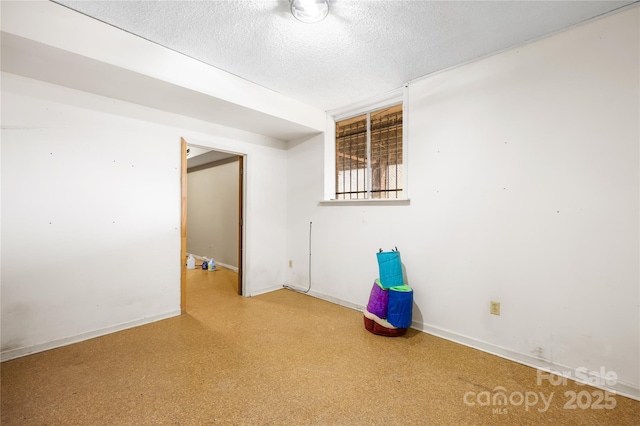 spare room with a textured ceiling