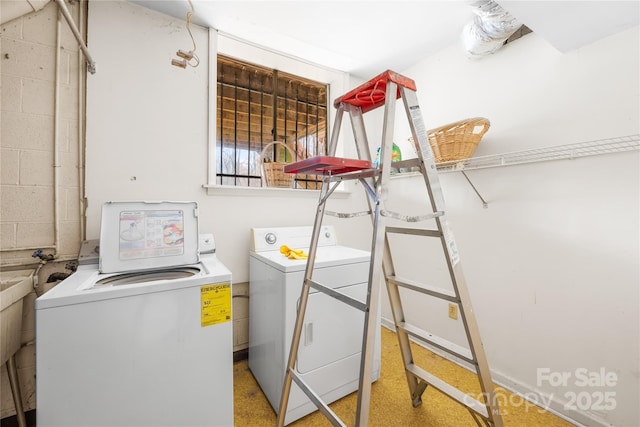 laundry area with washing machine and dryer