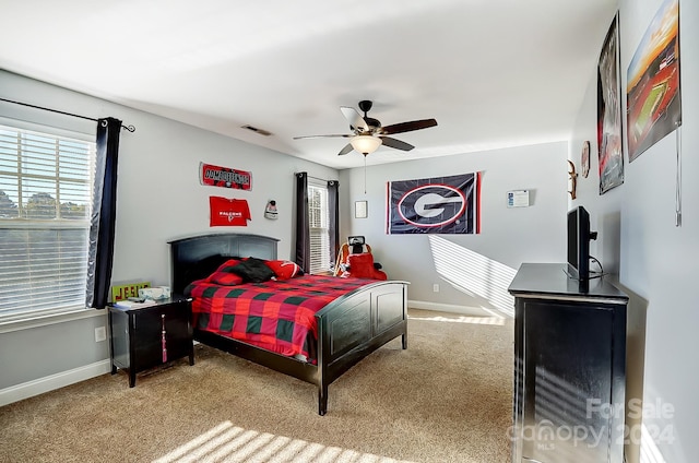 carpeted bedroom featuring ceiling fan