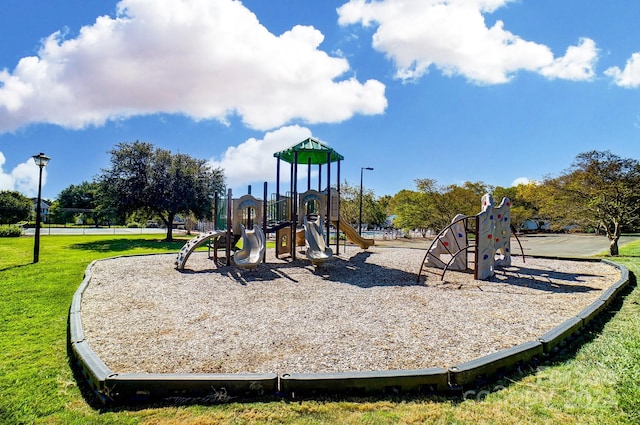 view of jungle gym with a lawn