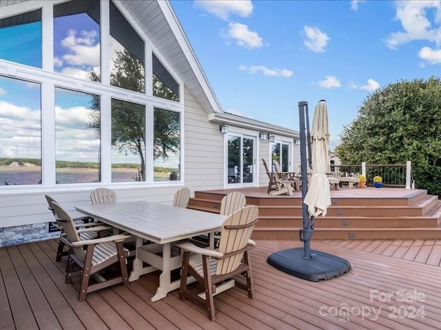 wooden deck with a water view