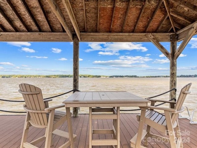 wooden deck featuring a water view