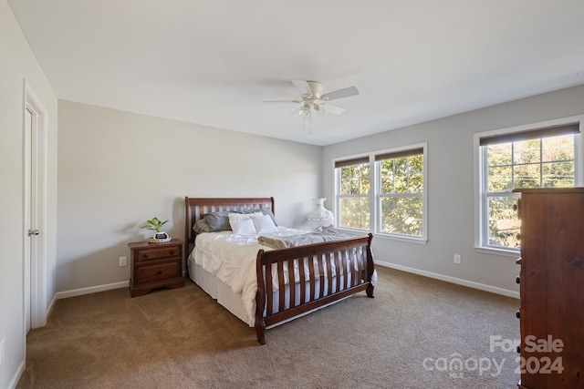 carpeted bedroom featuring ceiling fan