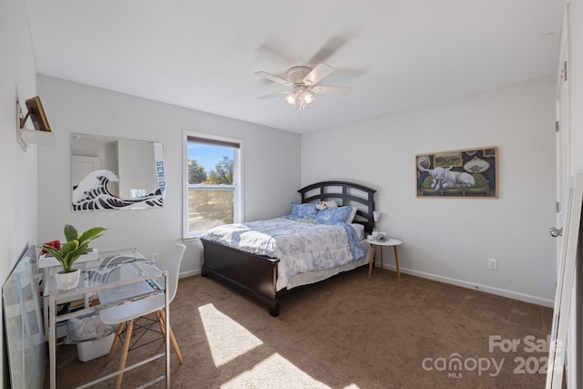 bedroom with dark colored carpet and ceiling fan