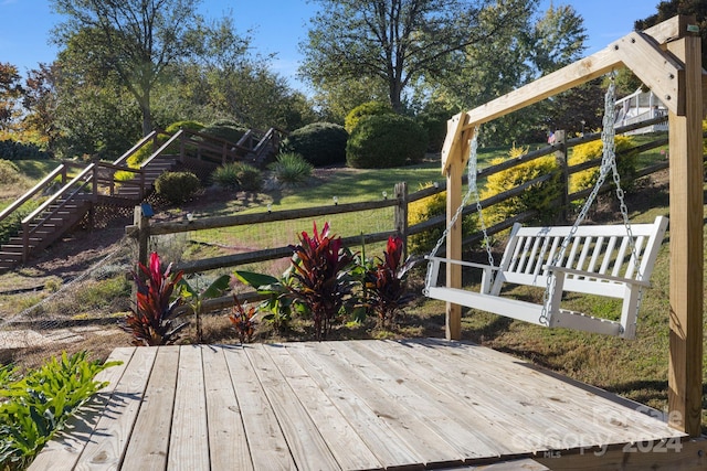 wooden deck with a lawn