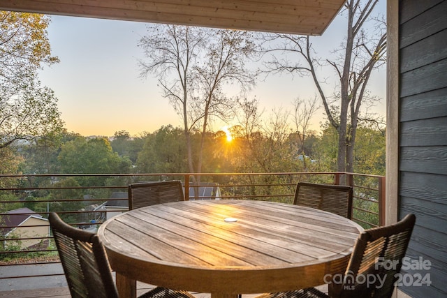 view of balcony at dusk