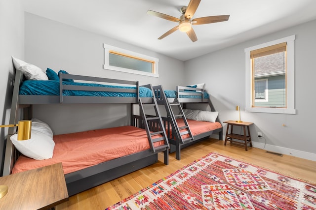 bedroom featuring hardwood / wood-style floors and ceiling fan