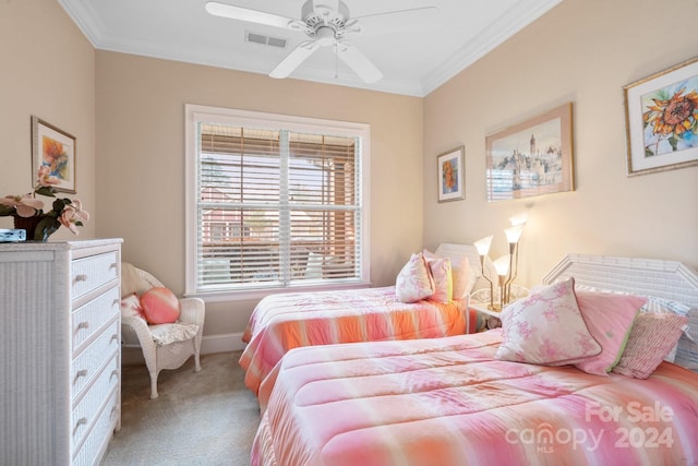 bedroom with carpet, ceiling fan, and crown molding