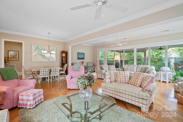 living room featuring light wood-type flooring and crown molding