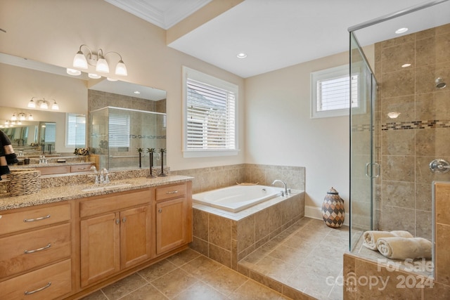 bathroom featuring tile patterned flooring, vanity, ornamental molding, and independent shower and bath