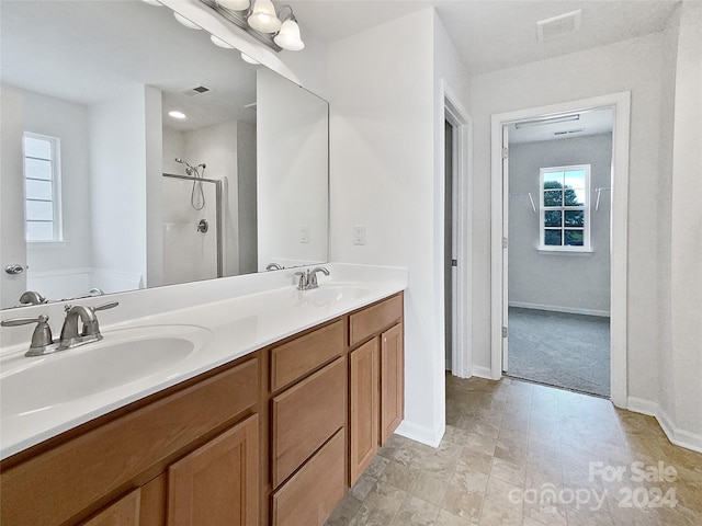 bathroom with vanity and independent shower and bath