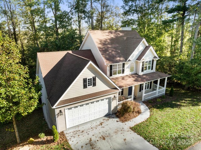 view of front of property featuring a garage and a porch