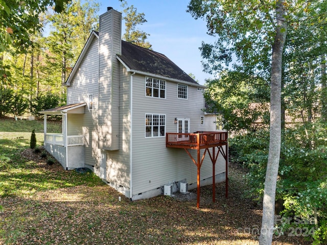 back of property featuring a deck