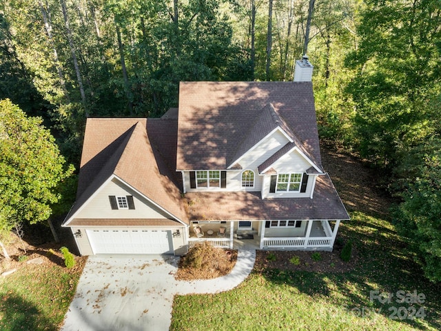 view of front of property featuring a garage and a porch