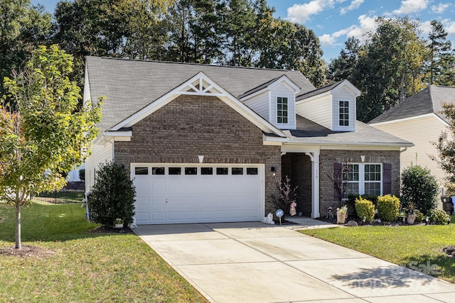 view of front of house with a garage and a front yard