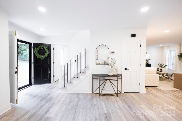 8946 Glencroft Rd, Mint Hill, NC 28227 - entryway with wood finished floors, stairway, healthy amount of natural light, recessed lighting, and ornamental molding