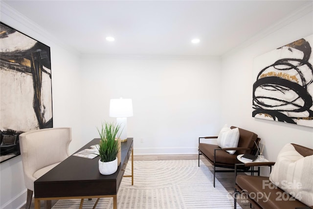 sitting room featuring ornamental molding and hardwood / wood-style floors