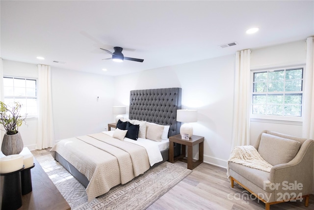 bedroom featuring ceiling fan and light wood-type flooring