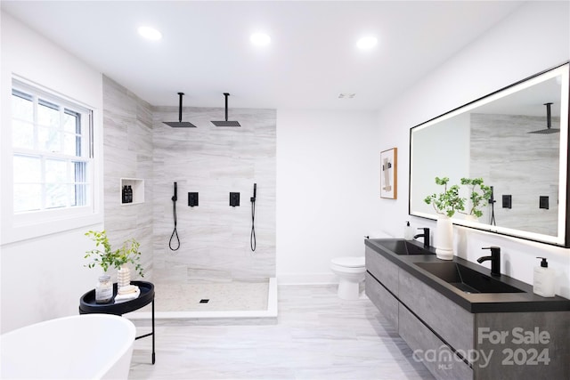 8946 Glencroft Rd, Mint Hill, NC 28227 - bathroom with walk in shower, double vanity, a freestanding tub, recessed lighting, and toilet