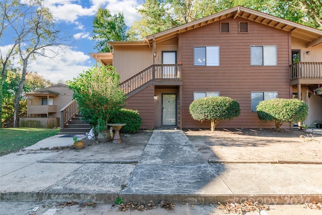 view of front of house featuring a balcony