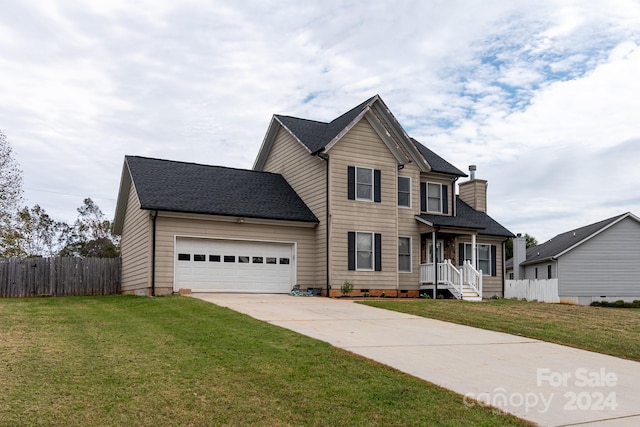 front of property featuring a garage and a front lawn