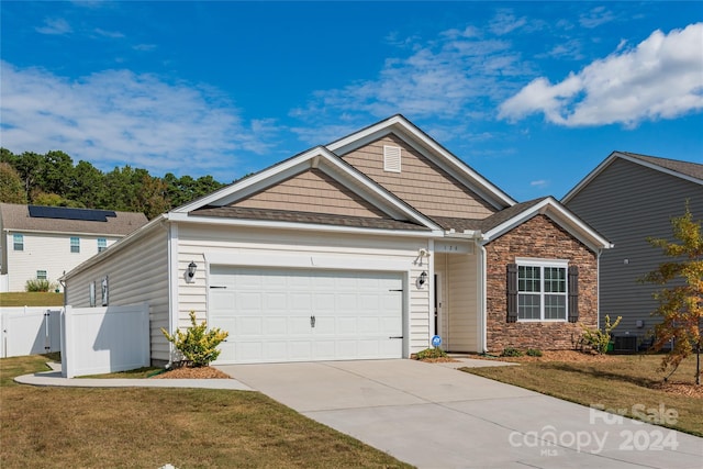 view of front facade featuring a front yard and a garage