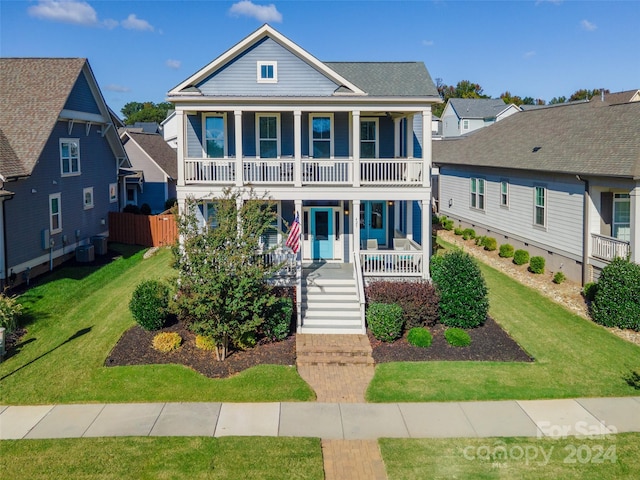 view of front of home with a front lawn and covered porch