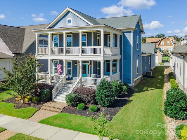 view of front of house with covered porch, central AC, a balcony, and a front lawn