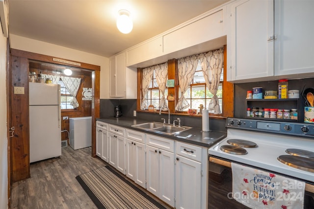 kitchen with dark hardwood / wood-style floors, white cabinetry, sink, and white appliances