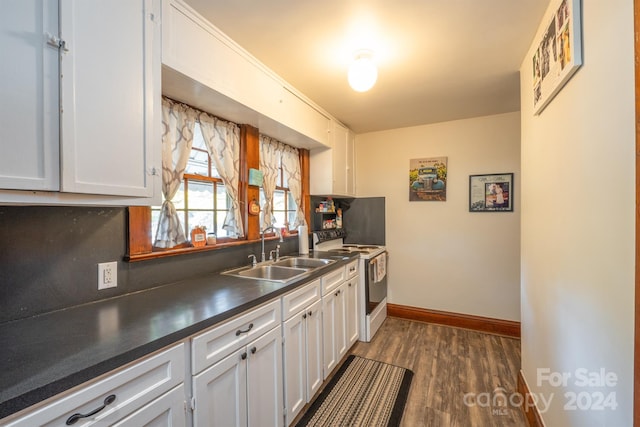 kitchen featuring sink, white cabinets, dark hardwood / wood-style floors, and electric stove