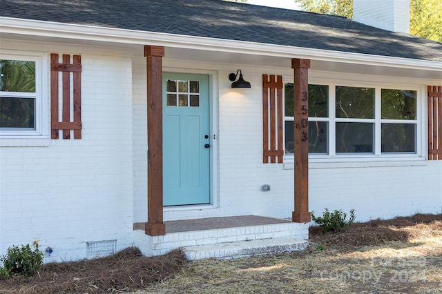 doorway to property featuring a porch