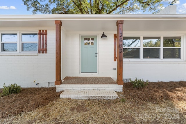 entrance to property with covered porch