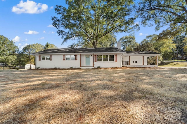 ranch-style home featuring a chimney