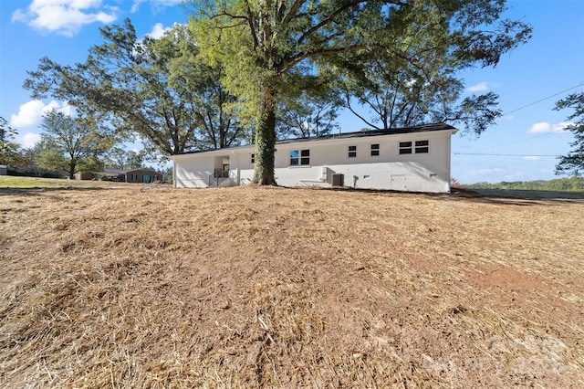 back of property with central AC unit