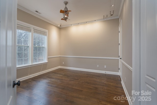 spare room with crown molding, dark hardwood / wood-style floors, and ceiling fan