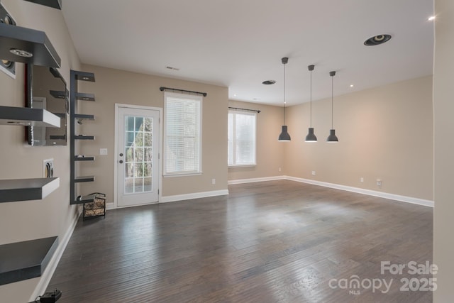 empty room with dark hardwood / wood-style floors