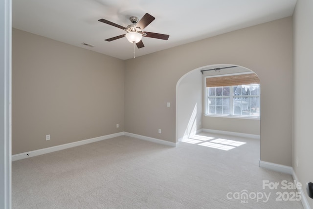 carpeted empty room with ceiling fan