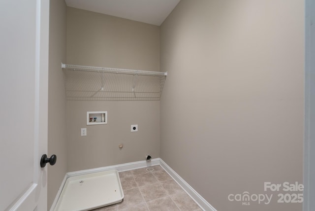 laundry room with hookup for a washing machine, gas dryer hookup, electric dryer hookup, and light tile patterned floors