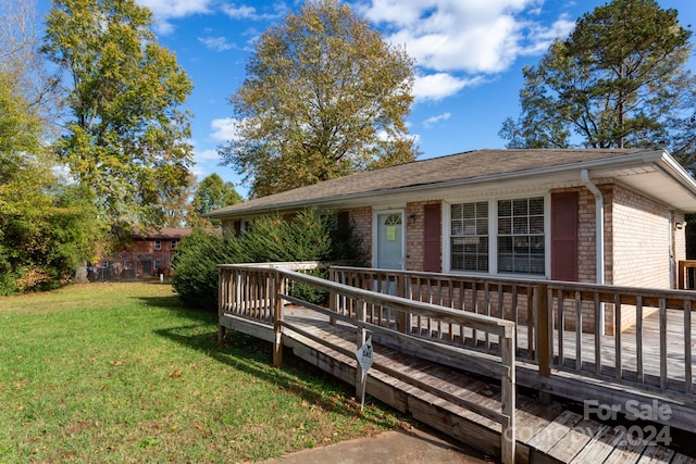 deck featuring a yard