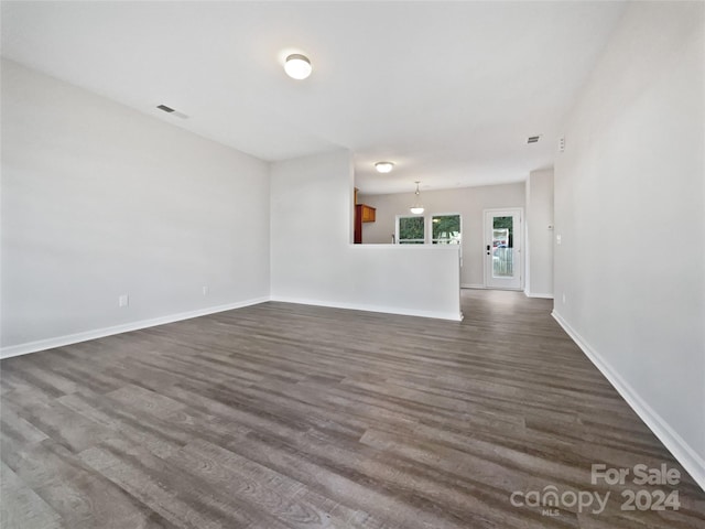 spare room featuring dark hardwood / wood-style flooring