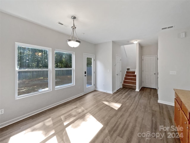 unfurnished living room featuring hardwood / wood-style floors