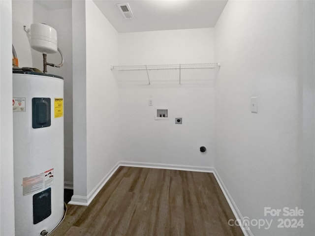 washroom featuring dark wood-type flooring, electric water heater, hookup for an electric dryer, and hookup for a washing machine