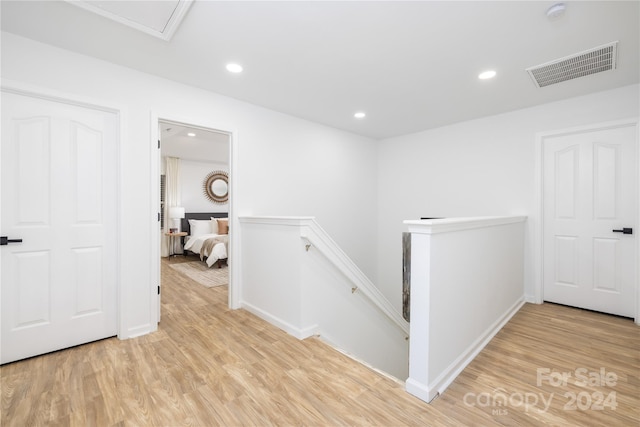 hall with light hardwood / wood-style flooring