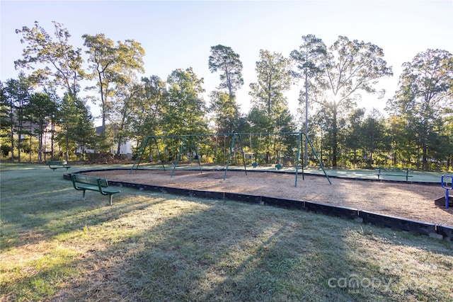 surrounding community featuring a yard and a playground